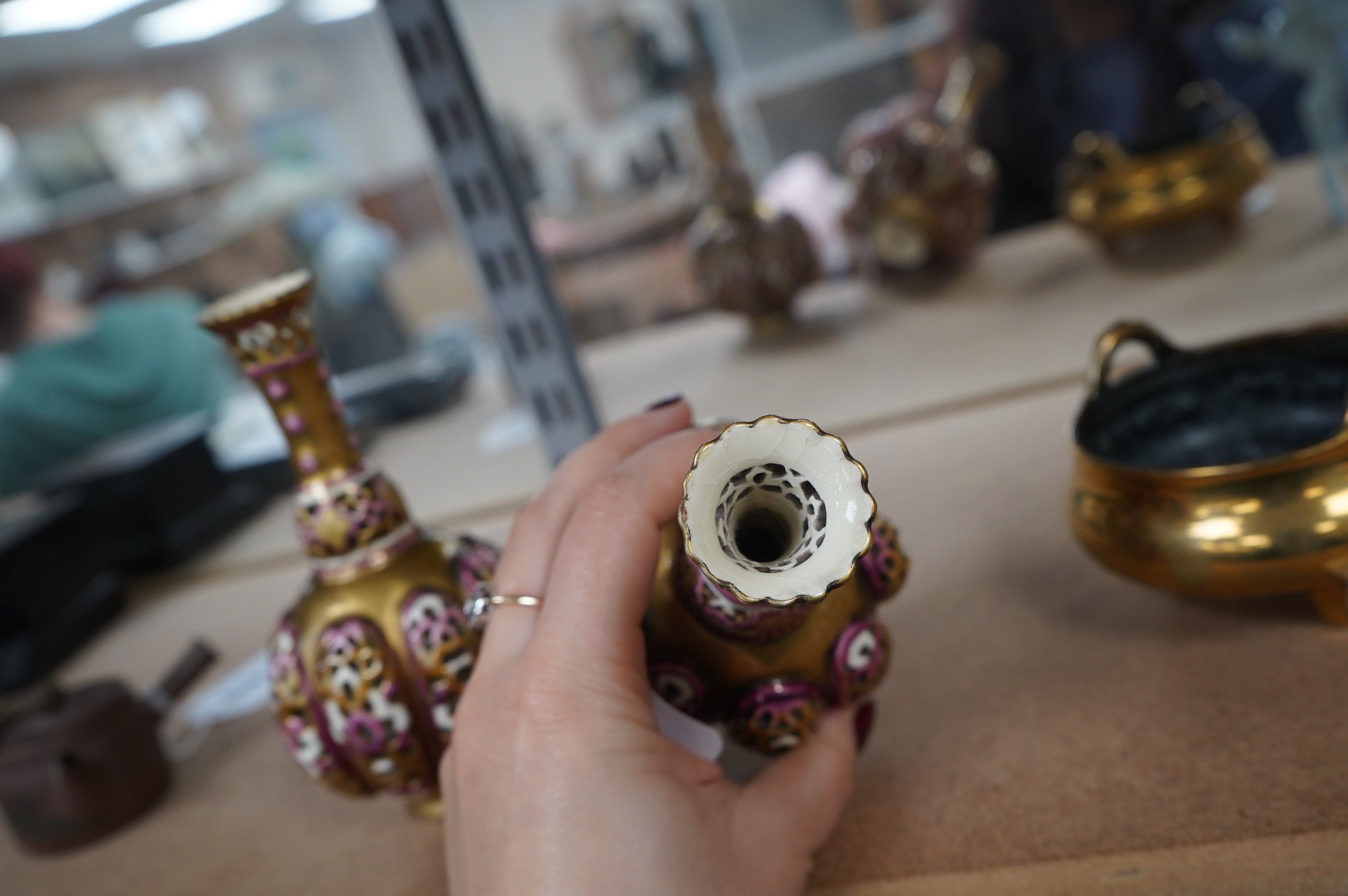 A pair of small Hungarian Zsolnay reticulated vases, 15cm high. Condition - good